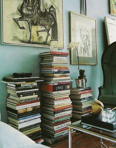 Top 10 Stylish Ways to Decorate Your Home with Books Decorate With Books Ideas, Book Set Up Aesthetic, Stylish Book Storage, Books On Floor Decor, Art Books Display, Book Stacks On Floor, How To Stack Books On Floor, Decorating With Books Ideas Living Rooms, Book Stack Nightstand