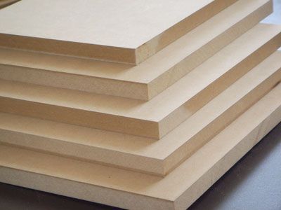 Medium-density fiberboard (MDF) is an engineered wood product made by gluing together hardwood and softwood fibers using a combo of wax and resin adhesive. This mix of fiber and adhesive is then put under high amounts of pressure and compressed into panels. Baseboard Styles, Mdf Panel, Add Storage, Staircase Makeover, Into The Wood, Fiber Board, Baseboards, Painting Cabinets, Particle Board