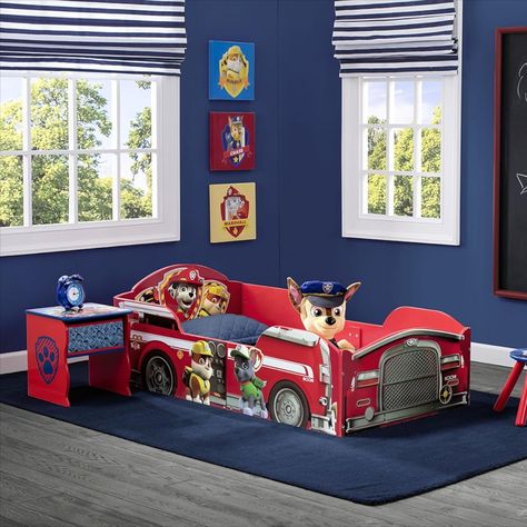 Functional with built-in study areas and multiple shelves for ample storage. Perfect for kids' rooms, dorms, and small spaces. Dimensions are 54.53"L x 29.92"W x 18.90"H with a maximum weight recommendation of 200 pounds. Includes safety features like 2 high side rails to ensure a secure transition to a big kid bed. Easy to assemble and JPMA certified. #DeltaChildren #ToddlerBed #PawPatrol #KidsFurniture #SafeSleeping #Sponsored Paw Patrol Room Decor, Wood Toddler Bed, Wooden Toddler Bed, Paw Patrol Bedroom, Paw Patrol Room, Toddler Bed Boy, Paw Patrol Theme, Colorful Fire, Truck Graphics