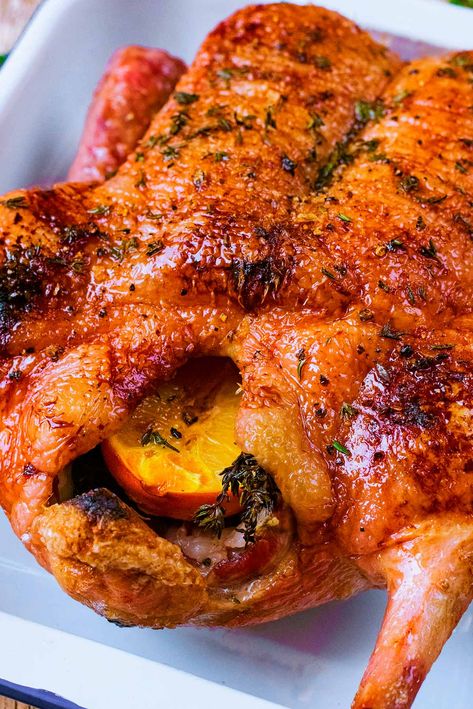 If you are looking for something a little bit different to serve for Christmas dinner or Thanksgiving, then why not try this Honey Roast Duck? Crispy slow roasted duck with a little sweetness from the honey and orange and a hint of thyme. The festive season doesn't have to be all about turkey, and your guests might appreciate the change. A whole duck, oven roasted to perfection - it's easy and healthy. How To Roast A Whole Duck, Thanksgiving Duck Recipes, Crockpot Duck Recipes, Duck Fat Recipes, Roasted Duck Whole, Duck Recipes Breast, Rotisserie Duck, Duck Recipes Whole, Duck Seasoning