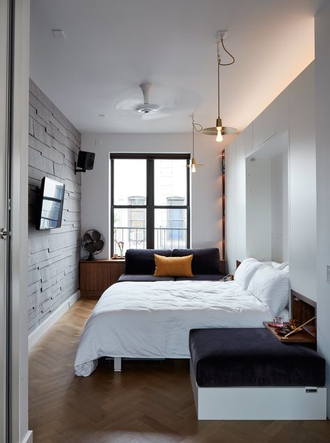 At night, the living-dining area converts into the primary bedroom. Soho Apartment, Small Apartment Bedrooms, Resource Furniture, Micro Apartment, Studio Apartment Decorating, New York Apartment, Trendy Bedroom, Bedroom Layouts, Small Room Bedroom