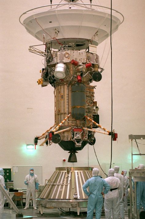 FILE – In this Friday Sept. 20, 1996 file photo, NASA’s Jet Propulsion Laboratory engineers and technicians lower the 3,420-pound Cassini Spacecraft into the Launch-Vehicle-Adapter at JPL in Pasadena, Calif. After a 20-year voyage, the spacecraft is poised to dive into Saturn on Friday, Sept. 15, 2016. (AP Photo/Frank Wiese) Cassini Spacecraft, Aerospace Design, Space Probe, Space Engineers, Visual Library, Major Tom, Aerospace Engineering, Spaceship Art, Space Pictures