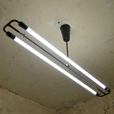 A simple single tube luminaire with proven standard fluorescent tube. One of the first neon lights made of traditionally manufactured metal components. Due to its exceptional form language, it is in demand wherever an extraordinary accent is to be placed. In large rooms, it is particularly striking in groups.  They are also available in white and steel with contrasting chrome or brass fitting. A  more simple ceiling rose is available leaving the rod more visible. Please email info Mannheim, Bucket Sink, Simple Ceiling, Sala Grande, Fluorescent Lamp, Garage Makeover, Fluorescent Tube, Bar Room, Tube Light