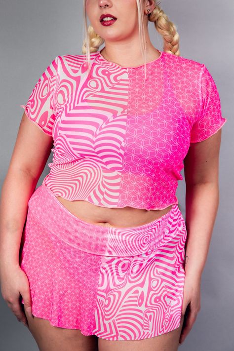 Shockingly stylish and perfect for partying! Our Electricity Mesh Baby Tee will keep you cool and looking electrifying as you dance the night away at any rave. With its unique mesh fabric, you'll never miss a beat. Power up your wardrobe with this must-have item! Product Details Duality but Neon Pink 🩷 UV Reactive FRW Exclusive! Mesh Crop Top for Extra Coverage Soft and Stretchy Handmade in San Diego, CA 90% Polyester 10% Spandex Satisfaction Guaranteed Lifetime Warranty *Rachel is wearing a size XLarge. Due to varying screen display settings, you may see some fabric images brighter or darker than the real fabric. So please consider that tolerance before ordering based on the website images. We won't be responsible for complaints regarding coloring. Hot Pink Festival Outfit, Plus Festival Outfit, Rave Plus Size Outfits, Breakaway Festival Outfits, Rave Jersey Outfit, Plus Size Rave Outfits, Modest Rave Outfits, Neon Outfit Ideas, Rave Festival Outfit Ideas