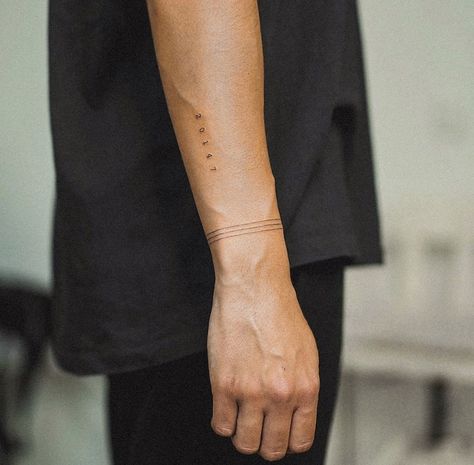 Mens Tattoo Minimalist, Minimal Wrist Tattoo Men, Tattoo Date Of Birth Numbers, Wrap Around Band Tattoo, Low Key Tattoos, Minimal Arm Band Tattoo, Stripes Tattoo Men, Solid Line Tattoo Arm, Wrap Around Line Tattoo