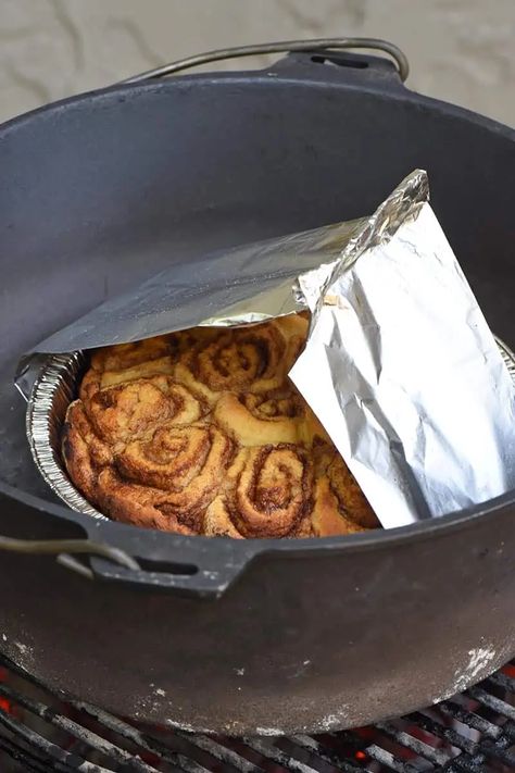 Here are two ways to make campfire cinnamon rolls, in a Dutch oven or pie iron. This ooey gooey, delicious camping recipe makes an easy breakfast you can make ahead and cook outdoors! It's perfect for the whole family; kids can help too! Campfire Cinnamon Rolls, Dutch Oven Breakfast, Dutch Oven Desserts, Easy Camping Breakfast, Make Cinnamon Rolls, Campfire Dinners, Dutch Oven Camping Recipes, Camp Oven, Camping Foods