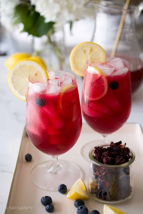 Blueberry Hibiscus Lemonade isn’t just a refreshing drink. It’s made with antioxidant rich ingredients like whole blueberries and real hibiscus flowers. I think it’s pretty common knowledge that blueberries are a superfood and packed with antioxidants, but did you know that hibiscus is another source of antioxidants? Yep! Combined with vitamin C rich lemon juice, this is a pretty good for you summer sipper! Flavored Lemonade Recipes, Hibiscus Tea Recipe, Hibiscus Lemonade, Hibiscus Flower Tea, Yummy Summer Cocktails, Flavored Lemonade, Drinks For Kids, Dried Hibiscus Flowers, Special Drinks