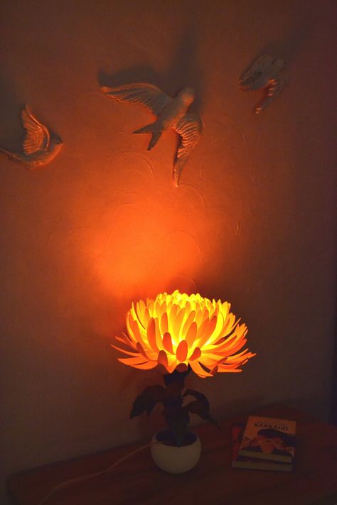 "Brigth Orange Chrysanthemum Flower LED Lamp ❤ Good for Farmhouse style.  Good for living room, bedroom, dorm or kids room. Perfect unique housewarming gift. Soft orange-red light. Made by hands from safe materials: isolon (foam material) for flower shade and leafs, metal+plastic for stem and electrical power components to make this flower shine.  The flower is in a ceramic pot. - powered by 220V. (Plug will be selected from the buyer's destination country or you can note it in your order.  By default we provide a 2 round pins plug (EU Standard 220v Electrical Wire). We will add a 2 flat pins plug for buyers from the United States, Canada and Japan) - LED-Lamp included. The flower lampshade can be removed for cleaning. Cleaning methods: ◦wipe it with a cloth ◦blow off the dust  ◦wash it wi Orange Chrysanthemum, Led Nightstand, Flower Led, Flower Lamp Shade, Fall Cottagecore, Cottagecore Room, Nightstand Table, Orange Lamps, Orange Rooms