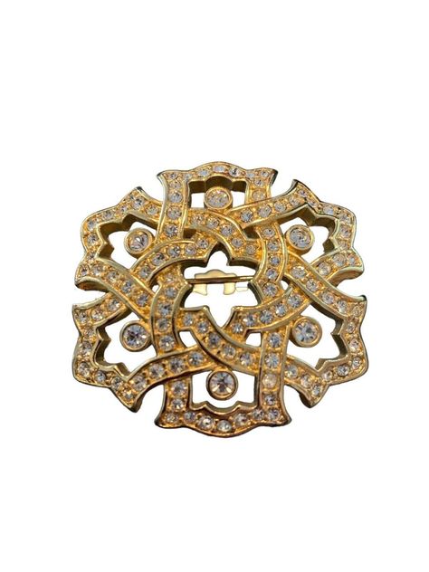 "Add a touch of elegance to your outfit with this stunning Swarovski brooch pin. The beautiful crystal stones are skillfully set in a pavé style, creating a sparkling effect that is sure to catch anyone's eye. The brooch is gold plated, adding an extra touch of luxury to this already beautiful piece. This Swarovski brooch pin is perfect for any occasion, whether it's a formal event or a casual outing. A great addition to any jewelry collection, it features the Swarovski brand name, known for its high-quality and exquisite designs. Dress up your outfit with this gorgeous brooch and make a statement wherever you go. 1 5/8\" x 1 5/8\". Excellent, giftgiving condition." Swarovski Brooch, Designs Dress, Crystal Stones, Embroidery Inspiration, Clothes Accessories, Exquisite Design, Stones And Crystals, Formal Event, Brooch Pin