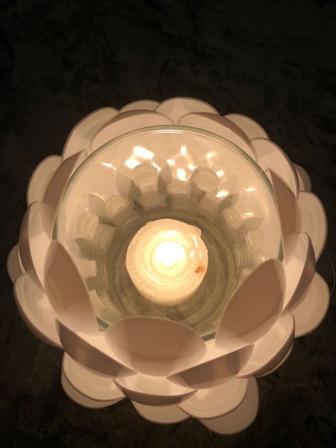 Used plastic spoons and a glass to create a tea light candle holder Tea Light Candle Holder, Plastic Spoons, Light Candle, Tealight Candle Holders, Spoons, Tea Light Candle, Handmade Crafts, Candle Holder, To Create