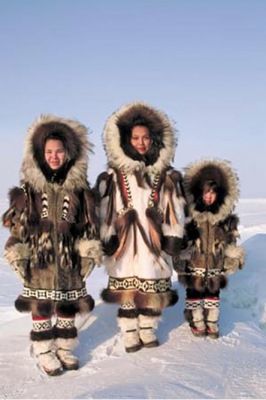 Inuit, Inupiat, and Yupik people, called Eskimos by 19th century Europeans, are the original inhabitants of the Arctic tundra of northern Canada, Alaska, Russia and Greenland. About 100,000 of them still live there. They were nomadic hunter-gatherers and lived near the coast in summer, building up food reserves for the winter. The rest of the year, they travelled hunting caribou, seals, polar bears, and whales...(click to see more). Inuit Clothing, Native Clothing, Urs Polar, Inuit People, Northern Canada, Inuit Art, Cultural Diversity, Fur Coats, People Of The World