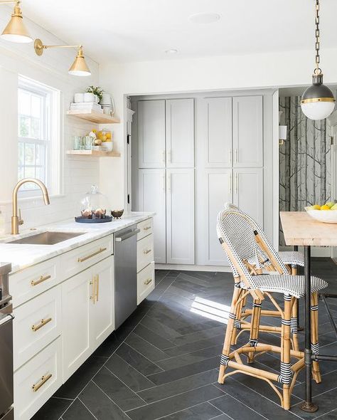 White and gold kitchen features white shaker cabinets adorned with brass hardware paired with calcutta marble countertops and a white subway tile backsplash facing a wall of floor to ceiling gray cabinets painted Benjamin Moore cape May Cobblestone. Kitchen Floor Inspiration, Dark Kitchen Floors, Herringbone Kitchen, Herringbone Tile Floors, White Shaker Cabinets, Herringbone Floor, Casa Vintage, Herringbone Tile, Classic Kitchen