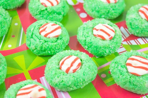 A close up of three grinch blossom christmas cookies. Grinch Blossom Cookies, Grinch Christmas Cookies, Grinch Desserts, Grinch Recipes, Grinch Food, Christmas Cookie Dough, Kisses Cookies, Grinch Night, Ice Cream Rainbow