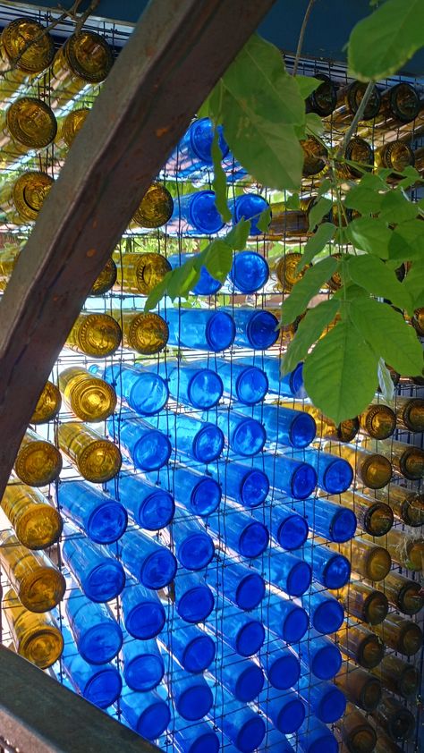 Glass Bottle Greenhouse, Colourful Garden Decor, Glass Bottle Wall, Outdoor Restaurant Design, Bottle House, Earthship Home, Privacy Fence Designs, Wine Wall Art, Recycled Glass Bottles