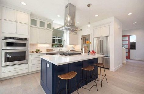 Kitchen with ceiling mounted range hood blue island and white cabinets Kitchen Island Range Hood, Kitchen Island Range, Kitchen Island With Cooktop, Kitchen Hood Ideas, Island With Stove, Kitchen Island With Stove, Kitchen Pantry Doors, Types Of Kitchen, Kitchen Hood Design