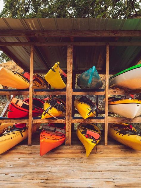 If you're reading this, chances are you’re a kayaking enthusiast like me, and you’ve just bought the kayak of your dreams. Now there’s only one problem to deal with. How will you store a kayak? Kayak storage has several crucial steps. These include keeping your kayak off the ground, deep cleaning it regularly, and using lots of protective padding. If you’re short on storage space, you can also opt for wall hangers #kayak Kayak Cart, Kayak Storage, Kayak Rack, Wooden Posts, Wall Hangers, 15 Diy, Rod Holder, Interior Decoration, Wall Hanger