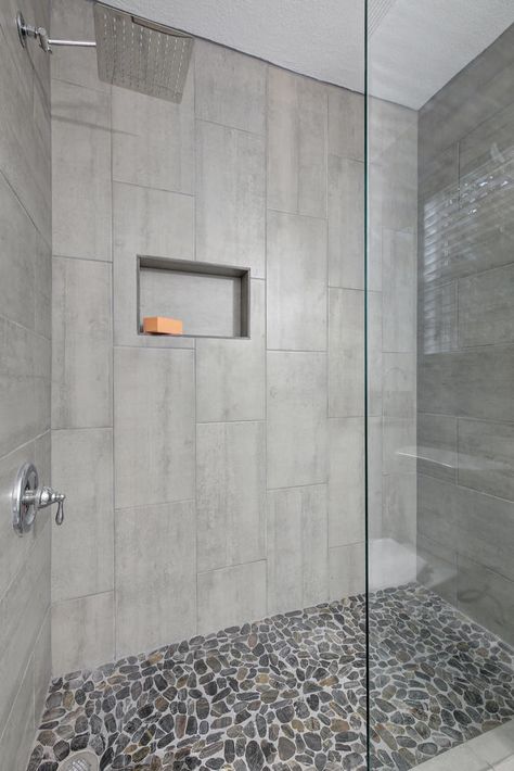 Walk-in Shower with Chrome Fixtures, and flat river rock shower floor Shower Floor Rock Tile, Grey River Rock Shower Floor, Stone Floor Shower River Rocks, Walk In Shower With Stone Floor, Walk In Shower Designs Tile Modern, Shower With Pebble Floor River Rocks, Stone Bottom Shower Pebble Floor, Stone Shower Floor Rocks, Showers With River Rock Floors