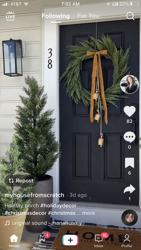 Christmas Decor Double Front Door, Garland Christmas Front Door, Porch Steps Christmas Decor, Double Front Door Christmas Decor, Double Door Holiday Decor, Front Porch Christmas Garland, Christmas Wreath On Front Gate, Apartment Porch Christmas Decor, House Christmas Decor Outdoor