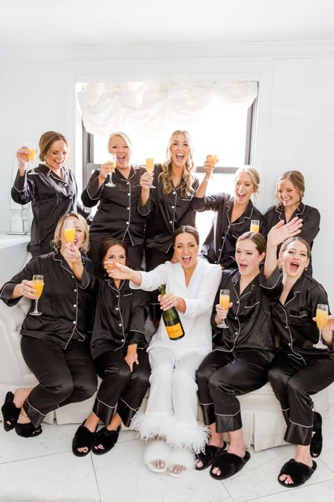 Bride and bridesmaids in silk black and white pajamas popping champagne while getting ready for a winter wedding Pjs Plus Size, Bridesmaids Pajamas, White Bachelorette, Bridesmaid Pajama, Bridesmaid Pictures, Black And White Wedding Theme, Bridal Party Getting Ready, Winter Bridesmaids, Bridesmaid Pajamas