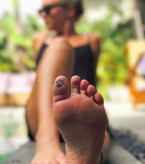 40 Best Hidden Tattoo Ideas | YourTango Tatoo Dog, Toe Tattoos, Pawprint Tattoo, Hidden Tattoos, Hamsa Tattoo, Paw Tattoo, Mother Tattoos, Tattoo Life, Tattoo Trends