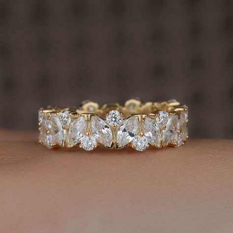 5.5MM Marquise and Round Moissanite Wedding Band, 14K Gold Full Eternity Ring, Lab Grown Diamond Ring, Wide Anniversary Bridal Matching Band ● 𝐃𝐢𝐚𝐦𝐨𝐧𝐝 𝐃𝐞𝐭𝐚𝐢𝐥𝐬: ➢ Shape: Marquise Cut and Round Cut ➢ Diamond Type: Lab Grown Diamond ( EF - VS) / Moissanite ( DE - VVS) ➢ Carat:  3.3 TCW apx 𝐑𝐢𝐧𝐠 𝐃𝐞𝐭𝐚𝐢𝐥𝐬: ➢ Shank Width : 5.5 MM ➢ Shank Thickness : 1.8 MM 𝐀𝐥𝐥 𝐥𝐢𝐬𝐭𝐞𝐝 𝐫𝐢𝐧𝐠 𝐚𝐫𝐞 𝐦𝐚𝐝𝐞 𝐚𝐬 𝐚 𝐜𝐮𝐬𝐭𝐨𝐦 𝐨𝐫𝐝𝐞𝐫, 𝐚𝐧𝐝 𝐡𝐞𝐧𝐜𝐞, 𝐭𝐡𝐞 𝐦𝐞𝐚𝐬𝐮𝐫𝐞𝐦𝐞𝐧𝐭𝐬 𝐨𝐫 𝐜𝐚𝐫𝐚𝐭 𝐰𝐞𝐢𝐠𝐡𝐭 𝐜𝐚𝐧 𝐝𝐢𝐟𝐟𝐞𝐫 𝐬𝐥𝐢𝐠𝐡𝐭𝐥𝐲 𝐝𝐞𝐩𝐞𝐧𝐝𝐢𝐧𝐠 𝐨𝐧 𝐭𝐡𝐞 𝐚𝐯𝐚𝐢𝐥𝐚𝐛𝐢𝐥𝐢𝐭𝐲 𝐨𝐟 𝐝𝐢𝐚𝐦𝐨𝐧𝐝𝐬. 𝐅𝐨𝐫 𝐦𝐨𝐫𝐞 𝐝𝐞𝐭𝐚𝐢𝐥𝐬, 𝐟𝐞𝐞𝐥 𝐟𝐫𝐞𝐞 𝐭𝐨 𝐜𝐨𝐧𝐭𝐚𝐜𝐭 𝐮𝐬. ● 𝐂𝐞𝐫𝐭𝐢𝐟𝐢𝐜𝐚𝐭𝐢𝐨𝐧 We do provide Jewelry Certificate on request Dazzling Eternity Band For Wedding, Wedding Eternity Band With Lab Grown Diamonds, Wedding Lab Grown Diamond Eternity Band, Marquise Brilliant Cut Eternity Band For Anniversary, Dazzling Gold Eternity Band For Wedding, Marquise Diamond Eternity Band For Wedding, Moissanite Eternity Band Wedding Fine Jewelry, Moissanite Eternity Band For Wedding, Baguette Cut Lab Grown Diamond Eternity Band For Wedding