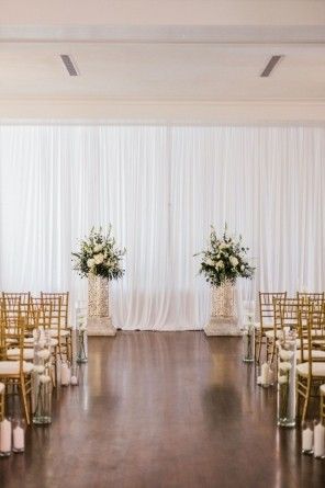 Indoor Alter Ideas, Indoor Wedding Ceremony Decorations Backdrops, Wedding Ceremony Indoor Backdrop, White Backdrop Wedding Ceremony, Indoor Wedding Ceremony Flowers, Small Wedding Ceremony Indoor, Indoor Wedding Alter, Simple Wedding Alter Ideas, Backdrop For Wedding Ceremony