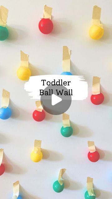 Melissa Kate on Instagram: "Set up the night before, surprise your toddler 🙌  We love vertical play with a ball wall 🟢🔵🔴 Use some colored balls like from the ball pit and secure with painters tape. For littles, they'll love pulling them off and placing in a basket. Older toddlers you could ask for specific colors too! Follow for more fun! 🎉  #kidsactivities #toddlermom #kidsactivityideas #kidsactivity #toddlerplay #boymom #momsofinstagram #momtips #momtricks #toddler #indooractivities #indooractivitiesforkids #toddlersofinstagram #toddlerfun #kidscraftideas #toddlercraftideas #toddlercrafts #momhack #asmr #playbasedlearning #preschoolactivities #preschoollearning #kidslearning" Tape Ball, Ball Pit Balls, Playbased Learning, Wall Balls, Learning Goals, Indoor Activities For Kids, Toddler Mom, Games For Toddlers, Ball Drop