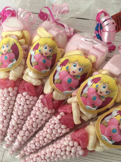 Princess peach sweet cones Princess Peach Mushroom Kingdom, Princess Peach Birthday Party Centerpiece, Mario Bros Princess Peach Birthday, Princess Peach Dessert, Mario Princess Birthday Party, Princess Peach And Daisy Birthday Party, Princess Peach Birthday Party Favors, Mario Birthday Party Princess Peach, Princess Peach Goodie Bags