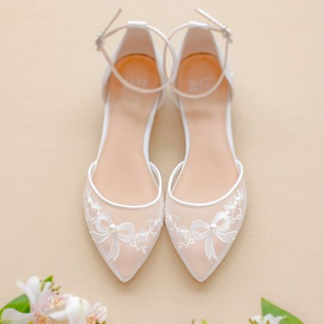 Meet Remi! Pretty and comfortable bridal flats with stunning pearl and embroidered bow details... We designed the perfect wedding flats for brides who love beauty and comfort! Remi is made with 1/4" an inch flat heels and amazing pearl and embroidered details on the finest ivory satin... Did we mention, Remi has the most comfortable fit! Perfect for modern brides! Also, these wedding shoes with flat heels are perfect for outdoor and garden weddings where you won't be worried about heels getting White Wedding Flats For Bride, Bridal Flats Shoes, Comfortable Wedding Flats, Gold Bridesmaid Shoes, Bridesmaid Shoes Flat, Wedding Flats For Bride, Bride Shoes Flats, Comfortable Wedding Heels, Gold Wedding Shoes