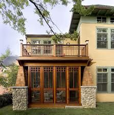 Craftsman style screened porch built under a balcony deck. Notice the stone work and heavy timber. | houzz.ocm Two Story Balcony Porches, Second Floor Deck, Veranda Design, Traditional Porch, Screened Porch Designs, Craftsman Decor, Gfx Design, Craftsman Exterior, Balcony Deck