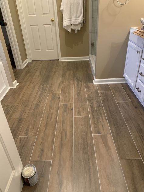 AHmazing pecan wood look tile and tan grout for the master bathroom floor.  We changed the grout to match the tile and like it a lot better Brown Floor Tiles Bathroom, Brown Floor Bathroom, Wood Looking Tile Floors, Tan Bathroom Tile, Bathroom Wood Tile, Bathroom Wood Floor, Bathroom Wooden Floor, Tan Grout, Shower Wood Floor