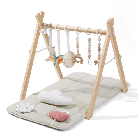 PRICES MAY VARY. SAFETY & STABILITY: With safety as our top priority, our wooden baby play gym is meticulously made from natural pine wood. Its smooth, burr-free surface and odorless composition ensure a safe baby play gym, validated by CPC testing. The sturdy triangle frame structure guarantees stability during your baby's playtime adventures COZY & SKIN-FRIENDLY MAT: Treat your little one to ultimate comfort with our soft, baby-safe play mat, measuring 35.6x17.1 inches. Crafted with care, the Baby Play Areas, Wooden Play Gym, Triangle Frame, Registry Ideas, Baby Play Gym, Gender Neutral Baby Gifts, Baby Room Neutral, Baby Playpen, Baby Nursery Neutral