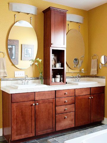 Above-the-Counter Storage:  For an easy and inexpensive solution, consider retrofitting an existing vanity with a storage unit placed on the countertop. Here, a slender but versatile piece of cabinetry sits between the vanity's two sinks, providing open and closed storage at arm's length. Long Double Vanity, Creative Bathroom Storage Ideas, Counter Top Storage, Bathroom Countertop Storage, Bathroom Storage Tower, Counter Storage, Top Bathroom Design, Bathroom Tile Inspiration, Bathroom Storage Ideas