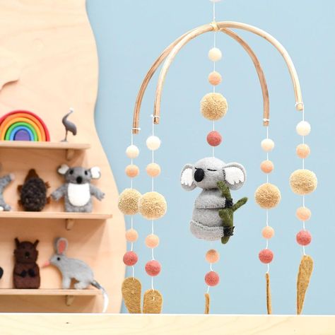 Tara Treasures on Instagram: “This 🐨 baby mobile features a sleepy koala hugging a tree branch, beautiful pompoms in earthy colours and eucalyptus leaves. . The frame is…” Koala Nursery, Pet Frame, Cot Mobile, Earthy Colours, Felt Mobile, Koala Baby, Baby Cot, Felt Baby, Nursery Mobile