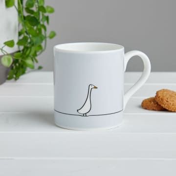 A simple duck illustration features here on a beautiful fine bone china mug. This charming illustration is the perfect companion for you as you enjoy your cup of tea or coffee. If you're looking for Duck related Gifts this is ideal for family and friends. Our lovely animal mugs are white fine bone china and are made by our trusty suppliers in Stoke-on-Trent, UK. • The mug has a light grey background giving it a stylish and contemporary feel. Penguin features just once around the bottom of the mu Stoke On Trent, Duck Mug, Runner Ducks, Light Grey Background, Animal Mugs, Traditional Ceramics, A Duck, China Mugs, Espresso Machines