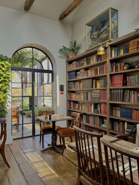 Bakery With Library, Literature Classroom Aesthetic, Coffeeshop Bookstore Aesthetic, Mismatched Furniture Cafe, Book Store Cafe Aesthetic, Coffee Book Shop Design, Cottagecore Cafe Interior, Bookstore With Cafe, Bookshop Coffee Shop