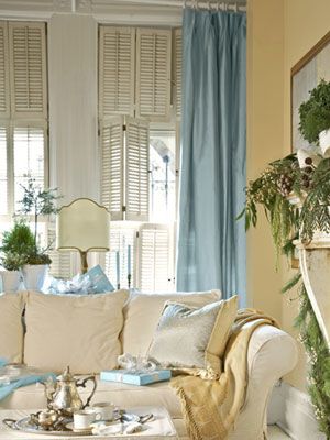 Hints of Blue  This otherwise neutral living room benefits from a hint of dressiness with curtains of soft blue raw silk. To invite cuddling up, use white slipcovers in soft, easy fabrics, like the brushed cotton on this sofa in the den, and layer on pillows and throws. Blue Curtains Living Room, White Slipcovers, Blue Living Room Decor, Coastal Living Rooms, Blue Curtains, Curtains Living, Neutral Living Room, Yellow Walls, Blue Living Room