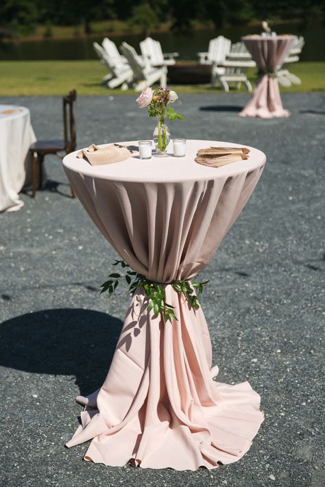 Pink linens tied with greenery for cocktail table highboys. Small floral centerpiece with personalized fans for your guests Wedding Cocktail Hour decor Planner @GloriaSchulzEvents Photo @jesswilliamsphotogrphy Venue @daisyhill Florals @Bloominghites Wedding Cocktail Hour Decor, Cocktail Table Centerpieces, Cocktail Table Styling, Wedding Cocktail Tables, Cocktail Table Decor, Cocktail Hour Decor, Wedding Cocktail Hour, Rustic Spring Wedding, White Wedding Decorations