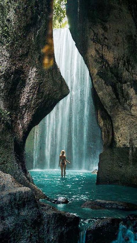 Tukad Cepung Waterfall is one of these places that you might want to consider putting on your travel checklist. This still remains as the best virgin waterfall of Bali. The sunlight falls on the glistening waterfall creating a rainbow, which feels as though it is projected right up to you. #tukadcepung #tukadcepungwaterfall #tukadcepungbali #bali #tukadcepungwaterfallbali Tukad Cepung, Bali Waterfalls, Bali Vacation, Bali Travel Guide, Dream Travel Destinations, Bali Travel, Lombok, Beautiful Places To Travel, Asia Travel