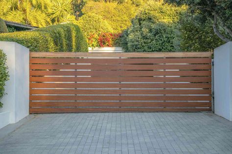 A driveway gate adds security and privacy to your home. Browse these options in varied styles and materials like wood, wrought iron, or aluminum to find yours. Aluminum Driveway Gates, Wood Gates Driveway, Drive Gates, Metal Driveway Gates, Modern Driveway, Aluminium Gates, Gate Ideas, Driveway Entrance, Cottage Aesthetic