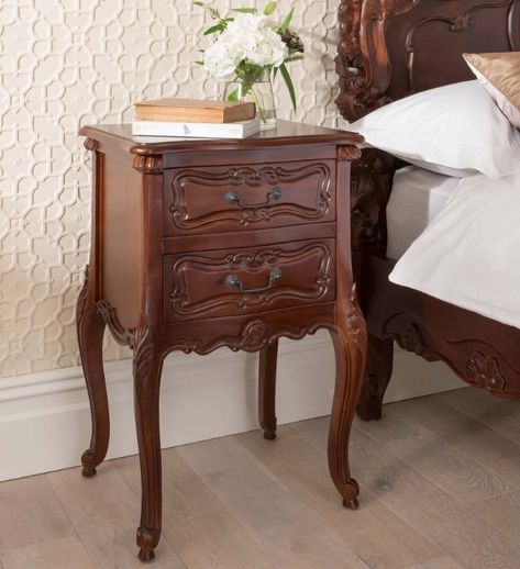 The bedside table is a very practical piece of furniture. It is where we keep our night-time essentials and table lamp. Read on to find our bedside table ideas. Whimsigoth Nightstand, Victorian Bedside Table, Bedside Table Vintage, Dark Brown Bedside Table, Bedside Table Antique, Victorian Bedroom Aesthetic, Brown Bedside Table, Bedside Table Aesthetic, Vintage Night Stand