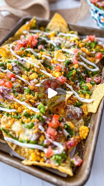 Pooja Jhunjhunwala on Instagram: "Paneer Nachos!! These are FIRE 🔥🧀
The recipe with all the instructions is on my website. Clickable LINK IN @theglobalvegetarian BIO 
OR go to www.theglobalvegetarian.com/recipes/paneer-nachos OR COMMENT *nacho recipe* OR *recipe* & ill DM YOU THE LINK!! 

Nachos are ALWAYS a good idea, like seriously who doesn’t like nachos?! This Paneer Nacho recipe is something everyone will LOVE! You’ve got crispy chips, refried beans, masala queso, more melted cheese, and chewy paneer all baked together and then topped with fresh salsa, the most addictive creamy chutney sauce, and sour cream. This Indian fusion recipe will win hearts!! 

Happy Cooking! 💗

#nachos #paneer #indianfood #cheese #fusionfood #vegetarian #theglobalvegetarian #vegetarianfood" Nacho Chips Recipe, Chutney Sauce, Nacho Recipe, Nacho Chips, Crispy Chips, Happy Cooking, Nachos Recipe, Fresh Salsa, Chips Recipe