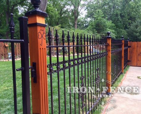 Using Wood Posts with Wrought Iron Fence for a Custom Look | Iron ... Iron And Wood Fence Ideas, Rod Iron Fences, Iron Fence Panels, Post Fence, Iron Fences, Wrought Iron Fence, Aluminum Fencing, Fence Plants, Black Fence