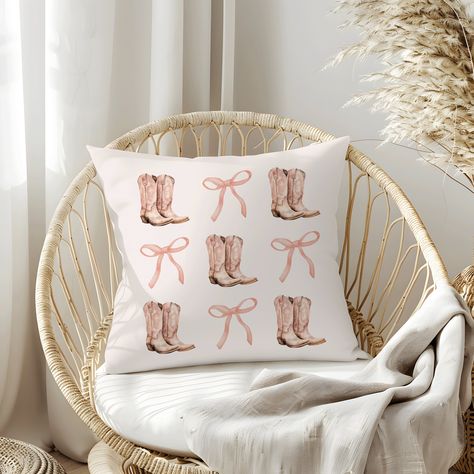 Our Coquette Cowgirl Pillow, featuring a Pink Bows Aesthetic and Cowboy Boots, is perfect for a Country Home Decor. This Bows and Boots Pillow makes an ideal Gift for Cowgirl Decor and a Cute Gift for Her Teen Room Decor.   Light tan pillow with boots and bows. 𝐌𝐀𝐓𝐂𝐇𝐈𝐍𝐆 𝐒𝐇𝐈𝐑𝐓 & 𝐓𝐎𝐓𝐄 𝐀𝐕𝐀𝐈𝐋𝐀𝐁𝐋𝐄 (𝐋𝐈𝐍𝐊𝐒 Shirt:  https://www.etsy.com/listing/1716212536/coquette-bow-shirt-summer-tshirt-comfort Tote:  https://www.etsy.com/listing/1713532536/cowgirl-tote-coquette-aesthetic Pink Country Aesthetic Room, Cute Pillows Pink, Pink Cowgirl Room Decor, Pink Cowgirl Decor, Pink Cowgirl Bedroom, Cowgirl Pillows, Cowgirl Bedding, Bows Aesthetic, Cowgirl Bedroom