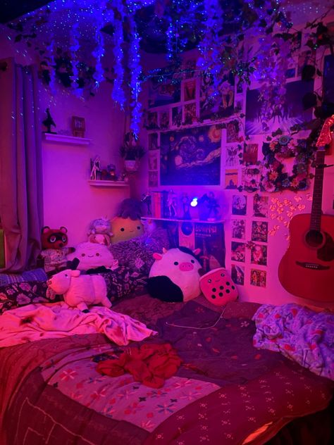 Really decorated bed with LED lights, a starry projector, Posters on the wall and ceiling, Vines hanging from the ceiling, Wisteria flowers hanging from the ceiling, Bedding from urban outfitters and stuffed animals on the bed Purple Light Room Aesthetic, Wisteria Room Decor, Wisteria Bedroom, Purple Fairycore Bedroom, Cute Bedroom Ideas For Small Rooms, Purple Room With Led Lights, Wisteria Room, Room Led Lights, Purple Led Lights Bedroom Aesthetic