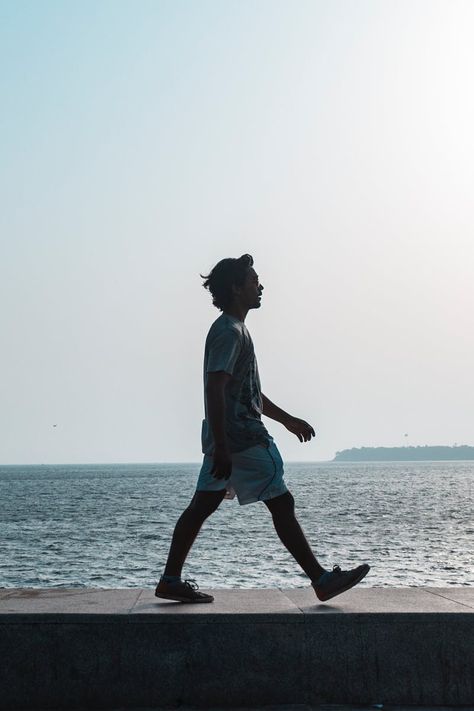 Man Walking Near Body of Water A Person Walking, Walking Sideways Reference, Poses Walking, Person Walking Reference Photo, Two People Walking Together Reference, Person Walking Photography, People Walking Photography, Person Walking Drawing Reference, Human Walking