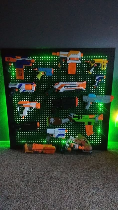 Nerf storage solution created by mom & dad Best Gamer Desk, Play/game Room Ideas, Ninja Room Ideas, Men’s Gaming Room Ideas, Minecraft Playroom Ideas, Gaming Room Kids Boys, Action Figure Storage For Kids, Nerf Fun Wall, Gamer Bedroom Decor Ideas