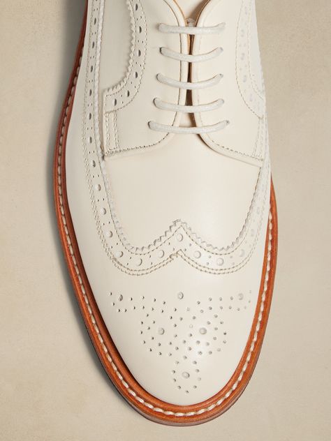 We reimagined the traditional oxford style with its intricate brogue detailing and wingtip silhouette, choosing a beautiful leather in a rich off-white ivory color from Portugal.  Portuguese leather uppers and lining.  Leather and rubber sole.  Blake stitch sole construction.  Made in Portugal.  B width.  Heel height: 0. 5" White Dress Shoes Men, White Oxford Shoes, White Oxford, Wingtip Oxford Shoes, White Dress Shoes, Wingtip Shoes, Oxford Style, Leather Loafer Shoes, Oxford White