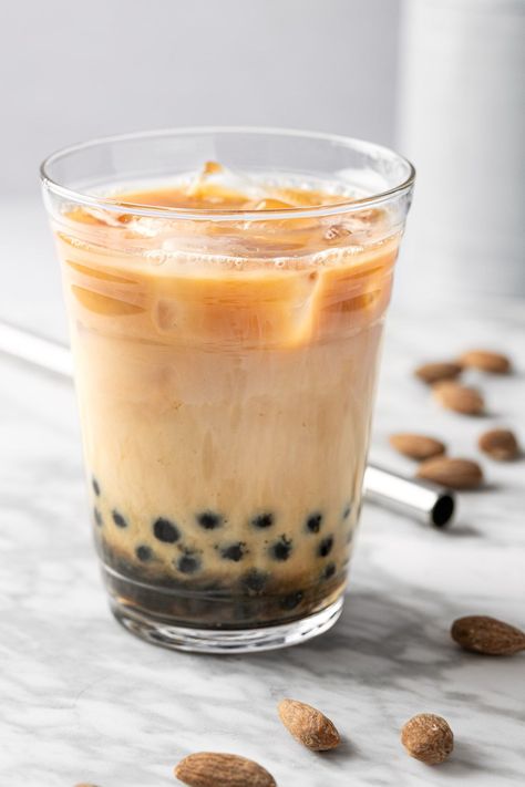 This refreshing almond milk tea is an easy & healthy homemade bubble tea recipe. Save money and time making this copycat drink at home! Homemade Bubble Tea, Almond Milk Tea, Boba Recipe, Boba Tea Recipe, Bubble Tea Flavors, Bubble Tea Straws, Bubble Tea Recipe, Milk Tea Recipes, Drink At Home