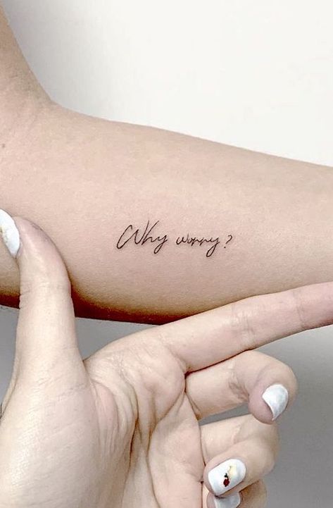 27 Positivity Tattoos That Will Put A Smile On Your Face - Our Mindful Life Why Tattoo Words, She Laughs Tattoo, Tattoos About Worrying, Simple Positive Tattoos, Worry Tattoo Ideas, Simple Motivational Tattoos, Positive Word Tattoos, Why Worry Tattoo, Don't Worry Tattoo